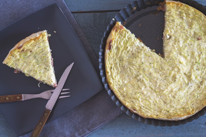 Quiche with zucchini and cottage cheese topping